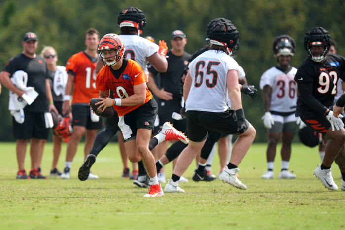 July 27, 2023; Cincinnati, OH, USA; Cincinnati Bengals quarterback Joe Burrow (9) suffers an injury on this scramble play during Cincinnati Bengals training camp practice, Thursday, July 27, 2023, at the practice fields next to Paycor Stadium in Cincinnati. Mandatory Credit: Kareem Elgazzar-USA TODAY NETWORK